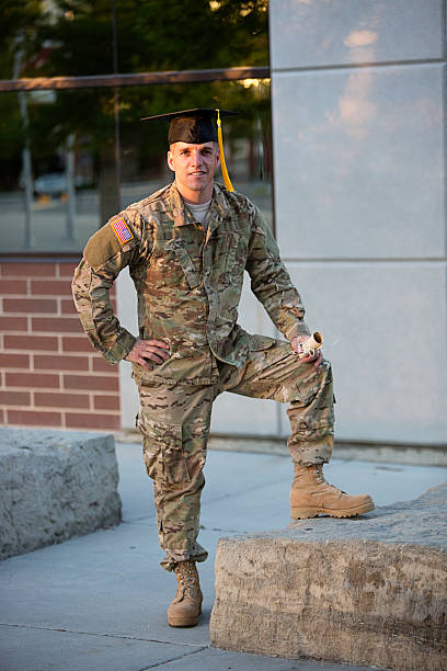 istock American Soldier with graduation hat 478052035
