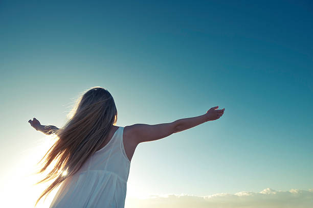 istock Joyful woman at sunrise 478052397