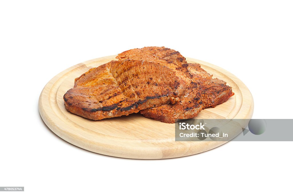 Grilled steaks on chopping board 2015 Stock Photo