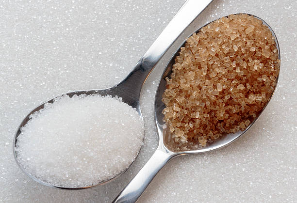 istock White and brown sugar on spoons 478054740