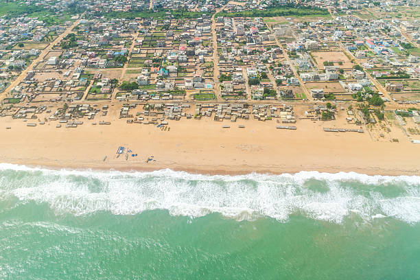 Aerial view of the shores of Cotonou, Benin Aerial view of the Atlantic Ocean coastline along the shores of Cotonou, Benin benin stock pictures, royalty-free photos & images