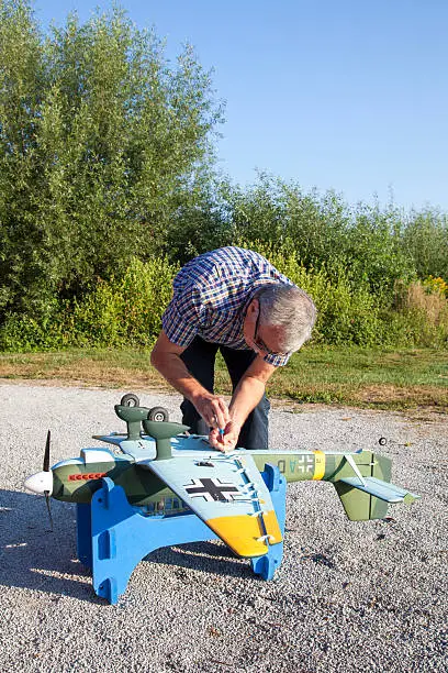 Photo of Friendly senior RC modeller and his new plane model