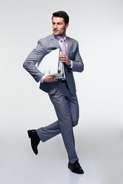istock Businessman running with folders 478059696