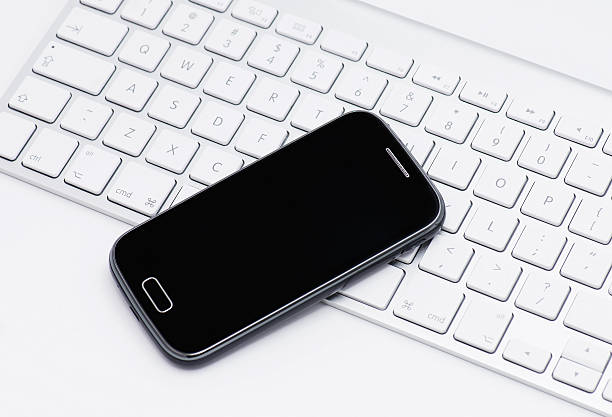 istock Business smartphone on the keyboard 478061283