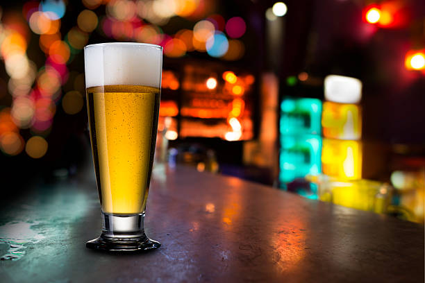 istock Glass of cold beer with bar scene 478061392
