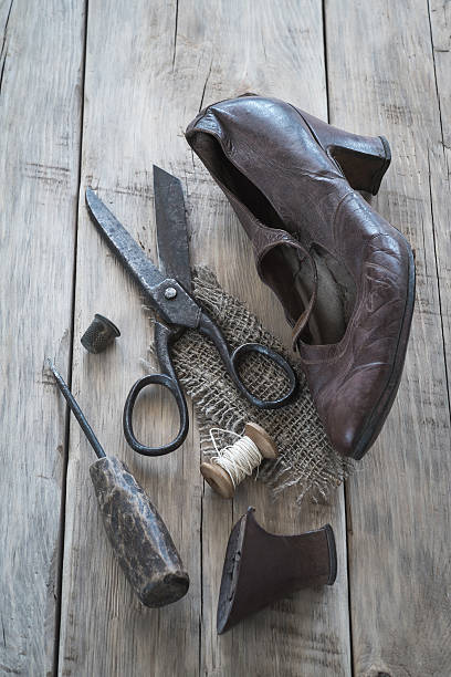 istock Old worn shoes and tools for recovery 478064404