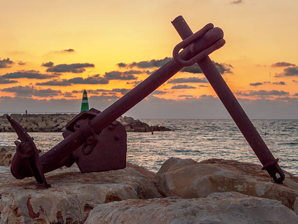 istock Sunset on the mediterrean via a rusty anchor 478065250