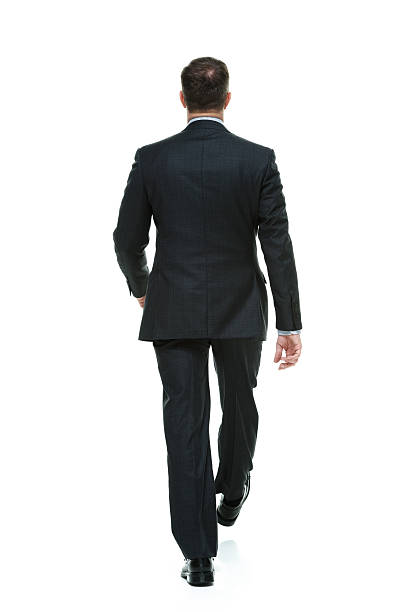 istock Rear view of businessman walking 478065581
