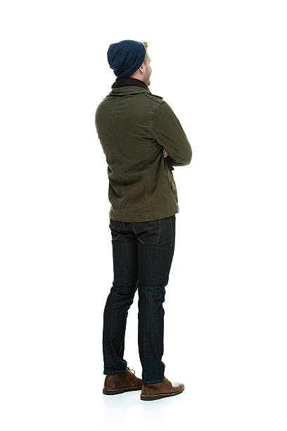 Rear view of man standing with arms crossed Rear view of man standing with arms crossedhttp://www.twodozendesign.info/i/1.png coat jacket winter isolated stock pictures, royalty-free photos & images