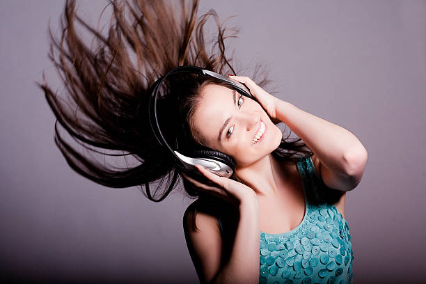 istock Girl With Headphones Singing On White Background 478066113