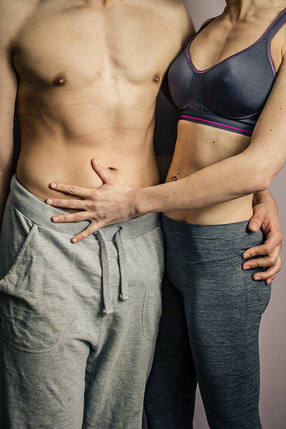 istock Athletic couple holding each other 478066581