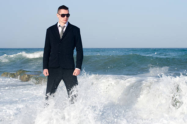 Young beautiful businessman enjoying his time on a beach