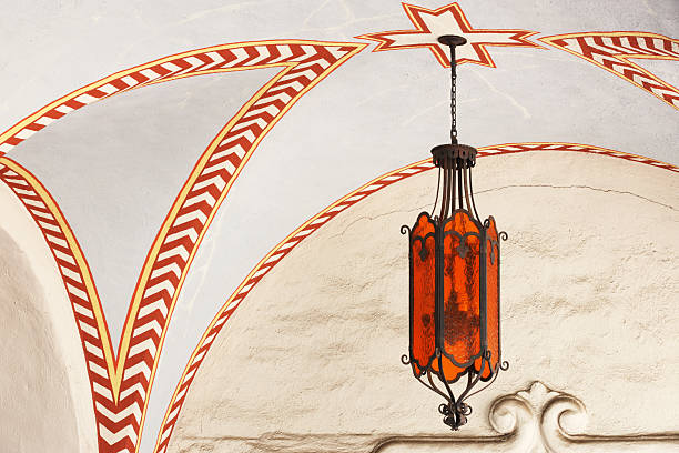 Ornate arched ceiling architecture and light fixture at San Gabriel mission.  San Gabriel, California, 2013.