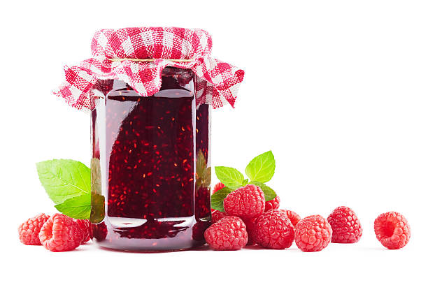 Raspberry jam Jar with raspberry jam with raspberries on white. raspberry jam stock pictures, royalty-free photos & images