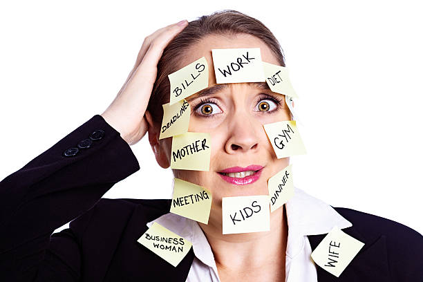 istock Overworked woman covered in  task reminders panics, unable to cope 478071839