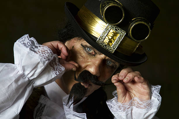 istock man dressed in steampunk, victorian clothing, dark wall background 478077546