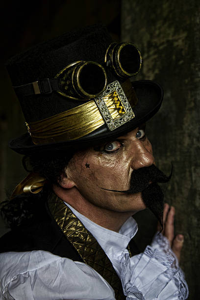 istock man dressed in steampunk, victorian clothing, dark wall background 478077578