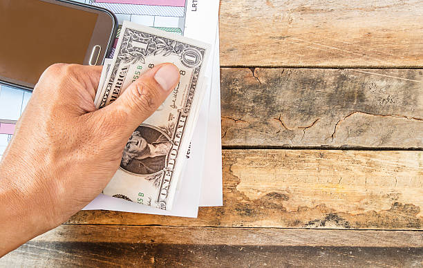 istock Hand holding dollar money 478083220