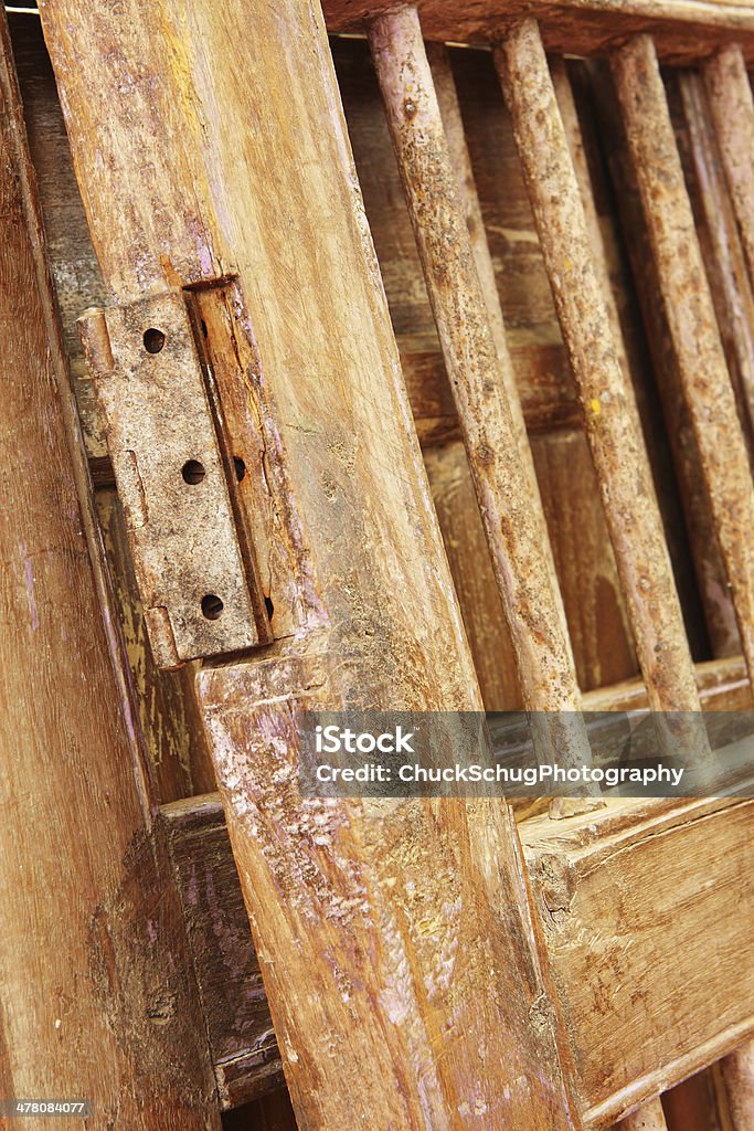 Door Hinge Rustic Vintage Doorframe Decor Crude vintage wooden door with pitted rusty hinge from Mexico - popular as a retro revival decor item in contemporary Southwestern homes.  Village of Oak Creek, Arizona, 2013. Antique Stock Photo