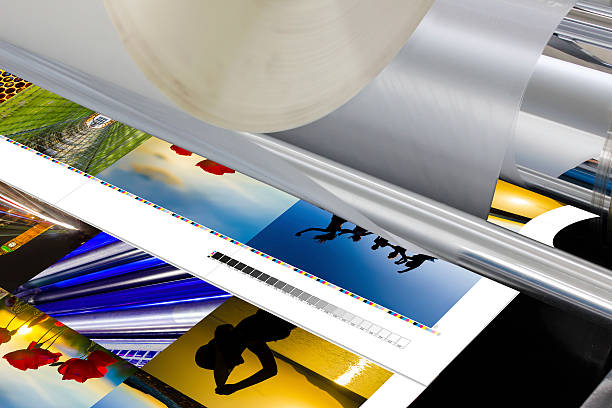 The laminator equipment for press in a modern printing house The laminator equipment for a press in a modern printing house digital printing house stock pictures, royalty-free photos & images