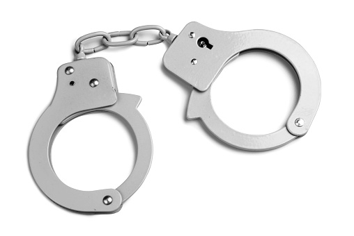 Metallic handcuffs isolated with clipping paths on white background