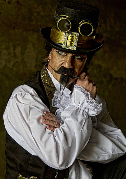 istock man dressed in steampunk, victorian clothing, dark wall background 478087196