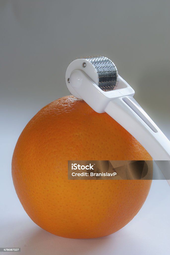 orange mit dermoroller - Lizenzfrei Abnehmen Stock-Foto