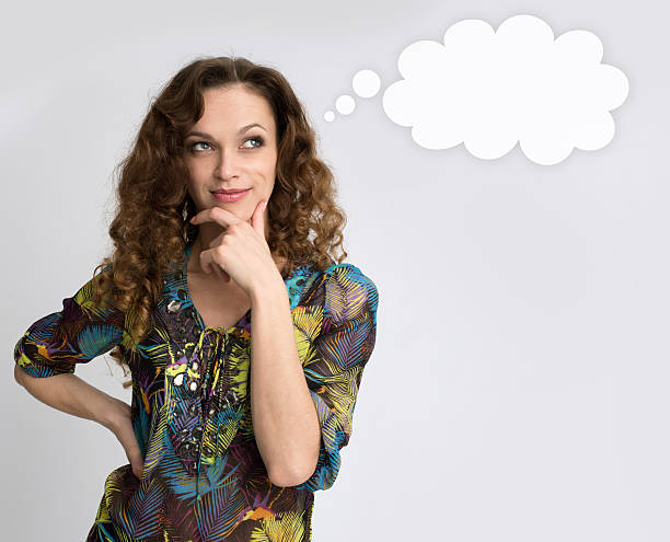 istock Beautiful thoughtful woman looking up 478087510