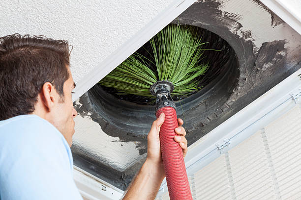 Cleaning Air Ducts Man cleaning air ducts in home. air duct photos stock pictures, royalty-free photos & images