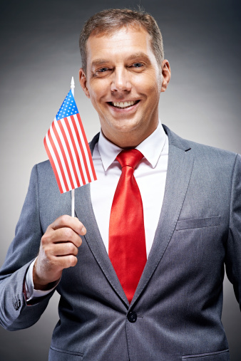 Politician holding American flag