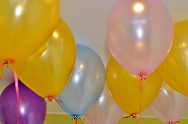 istock Nine hovering near the ceiling colorful balloons 478093376