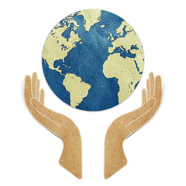 istock Hand and earth recycled paper 478094337