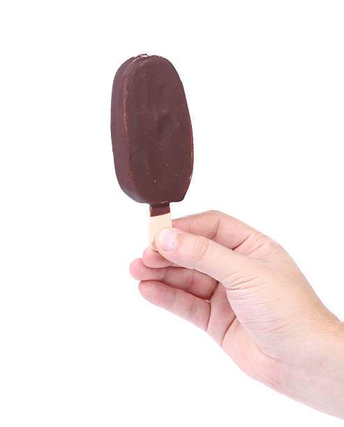 istock Hand holds chocolate vanilla ice cream 478094351