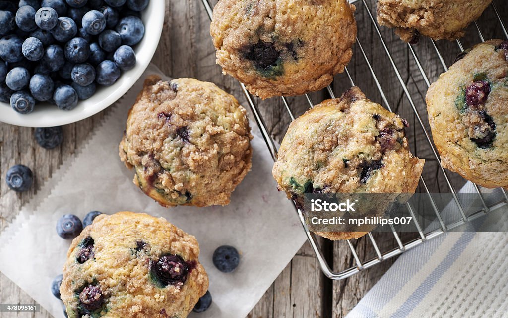 Blueberry Muffins Blueberry muffins with berries and cooling rack.  Please see my portfolio for other food and drink images. Blueberry Muffin Stock Photo