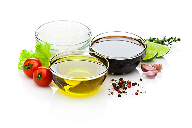 istock Olive oil and balsamic vinegar bowls on white backdrop 478096688