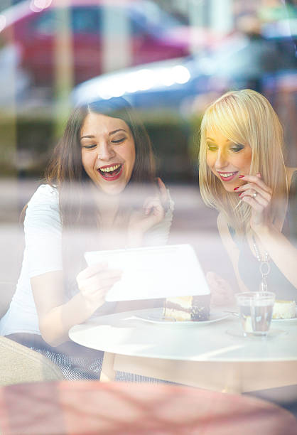 istock Best friends at the coffee bar using digital tablet 478096709