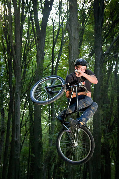istock Man doing a stunt on a mountain bike 478097382
