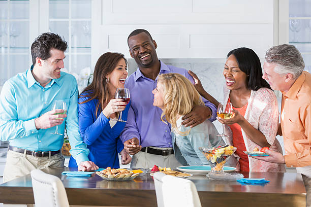 Group of multiracial adult friends having fun at a party