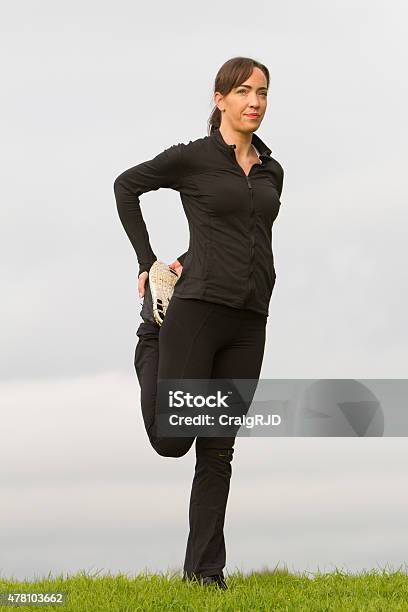 Female Athlete Stretching Stock Photo - Download Image Now - 20-29 Years, 2015, Adult