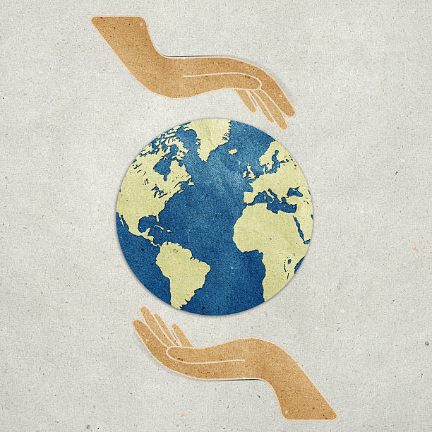 istock Hand and earth recycled paper 478105007