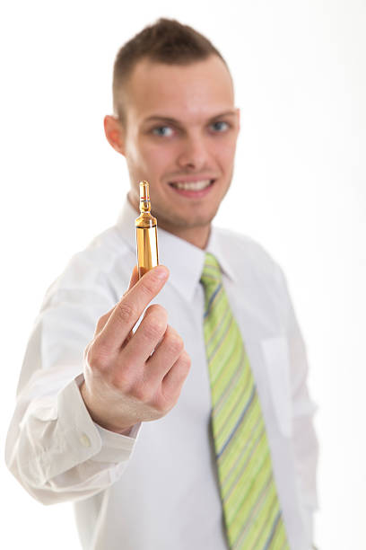 istock Young smiley doctor recommend ampule 478106395