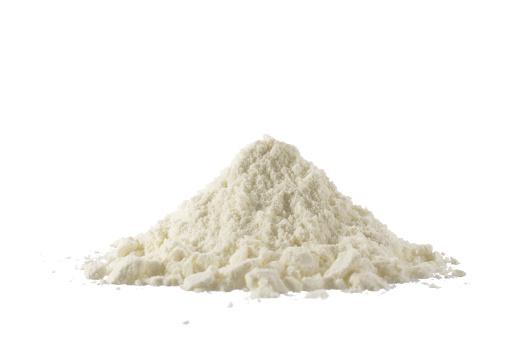 Heap of powdered organic milk isolated on white background