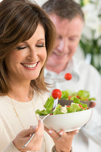 istock Mature couple eating a healthy salad 478106927