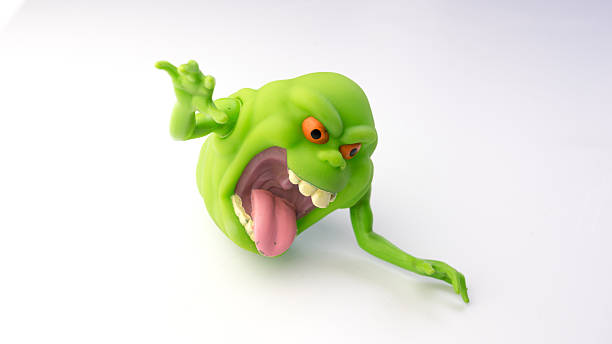 3D digital render of a cute smiling alien holding a space gun in a hand isolated on white background