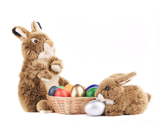 istock Toy rabbits with a basket of Easter eggs. 478108259