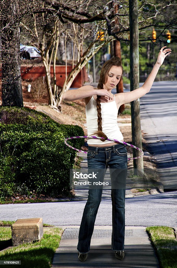 Girl with Hula Hoop Young teenage woman with a hula hoop Active Lifestyle Stock Photo