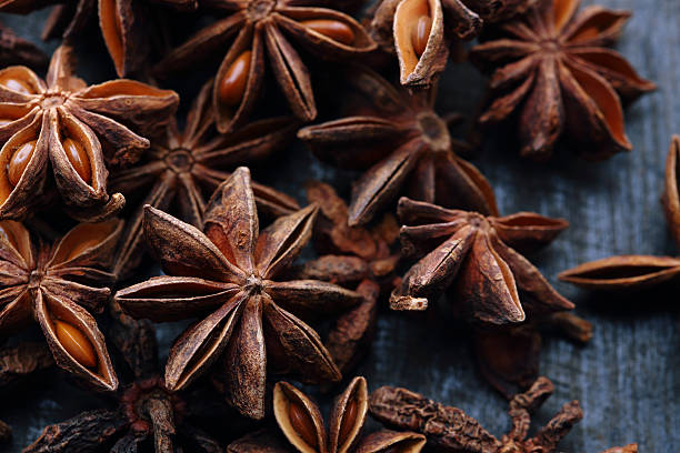 Star anise seeds on the wooden background stock photo