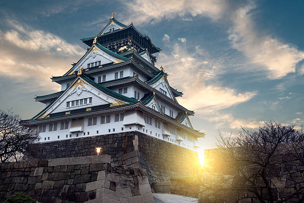 Osaka Castle Osaka, Japan - December 29, 2014: Early morning sky over Osaka Castle in Osaka, Japan. osaka castle stock pictures, royalty-free photos & images