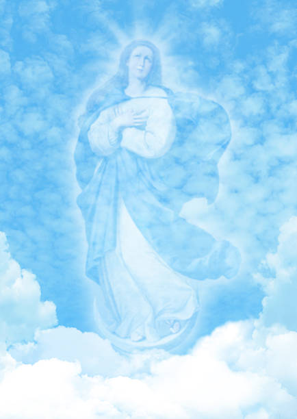 Virgin Mary on blue sky clouds background vertical image