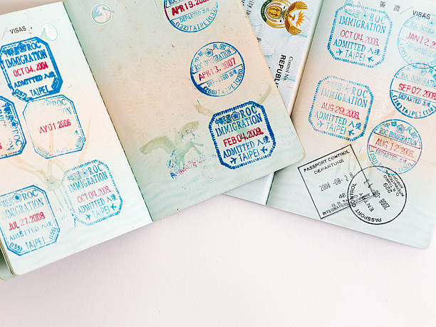 istock Visas and stamps in passport 478116794